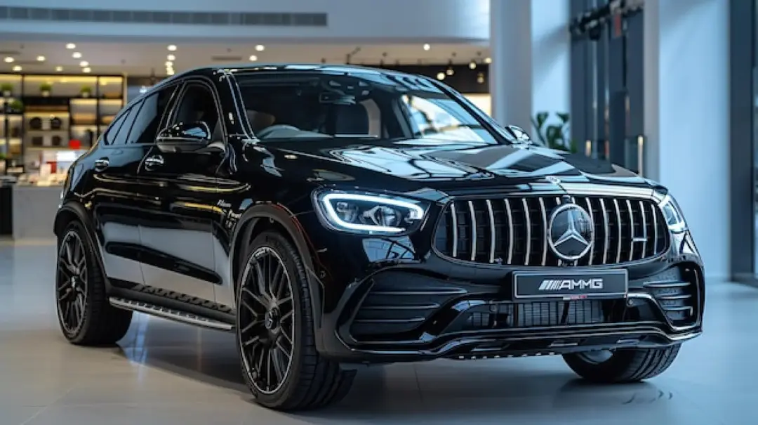 Black Mercedes-AMG SUV coupe in a showroom